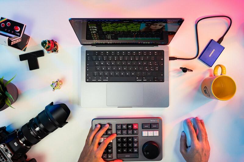 Entrepreneur typing on keyboard creating content for multiple platforms